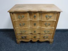 A continental light oak four drawer chest