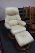 A cream leather relaxer chair with footstool