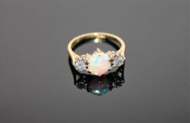 An 18ct gold opal and diamond three stone ring,