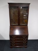 A Victorian style mahogany bureau bookcase