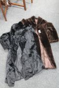 A vintage fur coat together with one other coat.