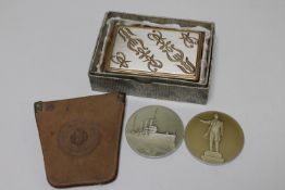 Two Russian presentation tokens and a musical compact