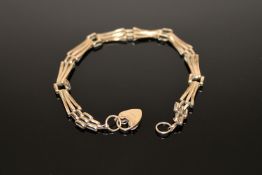 A 9ct gold padlock bracelet, 4.