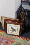 A collection of four tapestry embroidered pictures in blue frames, Oriental style embroideries etc.