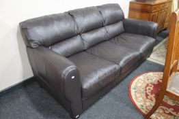 A brown leather settee