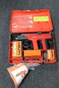 A Hilti nail gun DX450 with instructions