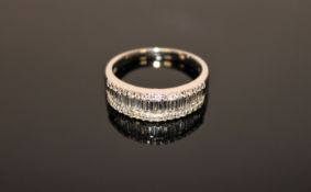 An 18ct white gold diamond half eternity ring, size R/S.