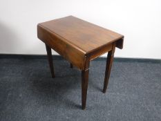 A 19th century mahogany flap sided table