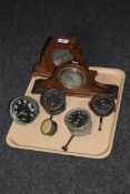 A tray containing two early 20th century oak mantel clocks, Jaeger clocks,