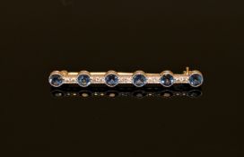 An Art Deco sapphire and diamond bar brooch