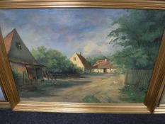 A continental gilt framed oil on canvas - cottages in rural village