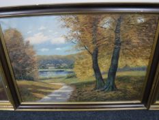 A continental oil on canvas - autumn trees with lake beyond