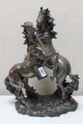 An Academy figure of two rearing stallions