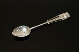 A Liberty and Co Art Nouveau silver spoon 'DECOS' designed by Archibald Knox,