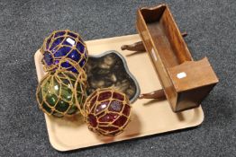 A tray of antique glass balls, miniature crib,