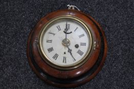 An early 20th century oak cased circular wall clock