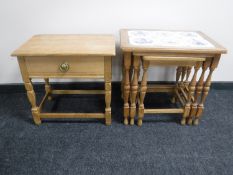 A nest of oak tiled topped tables and a small oak table fitted a drawer