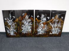 A set of four lacquered Japanese mother of pearl panels