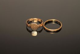 A 22ct gold band ring, 1.5g, and an 18ct gold ring, 1.