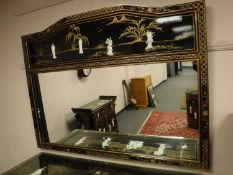 A Japanese mirror with mother of pearl figures