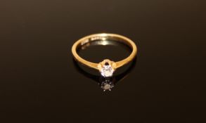 An 18ct gold solitaire diamond ring, size Q, 2.2g.