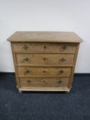 A 19th century stripped pine four drawer chest