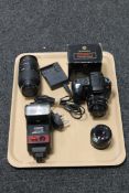 A Sony SLR Digital camera and charger with a Minolta 35-70 lens,