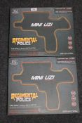 Two boxed Regimental Police mini uzi toy guns