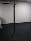 A curved steel hat and coat stand