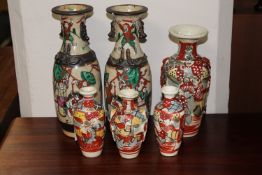 Six 20th century oriental earthenware vases