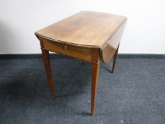 An early 20th century flap sided occasional table