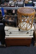 A lacquered storage case together with a cane footstool and two wooden trunks