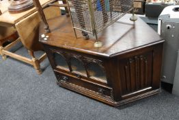 A oak linen fold TV stand