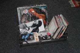 A crate containing 1980's singles,