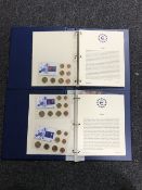 Two folders containing a quantity of European coins