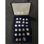 A blue fitted coin case containing twenty three British,