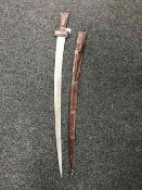 An Eastern leather handled sword in scabbard