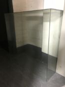 A large glass display case and a notice board