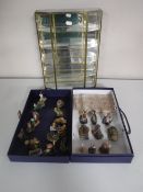 A brass and glass curio cabinet together with a set of woodland miniature figures with certificates