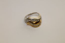 An 18ct gold yellow and white gold ring set with 12 diamonds, 14.