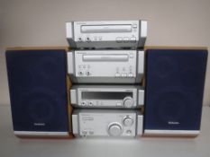 A Technics four piece mini stack system with speakers