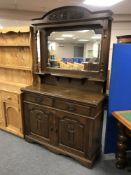 An Edwardian oak mirror back sideboard