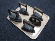 A tray of five vintage irons