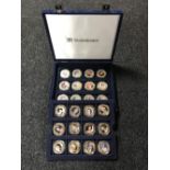 A blue fitted coin case containing twenty four Fifty Pence commemorative coins - Diamond Jubilee