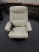 A cream leather heated massage chair