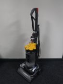 A Dyson DC 33 upright vacuum cleaner
