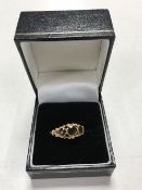 A 9ct gold three stone garnet ring,