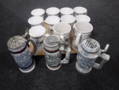 Three pewter lidded Avon tankards together with a tray of nineteen Newcastle china oversized mugs