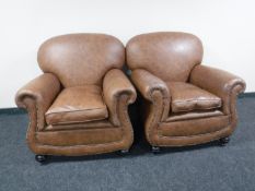 A pair of early 20th century armchairs re-upholstered in brown leather CONDITION REPORT: