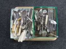 A tray of stainless steel and plated cutlery plus sugar tongs